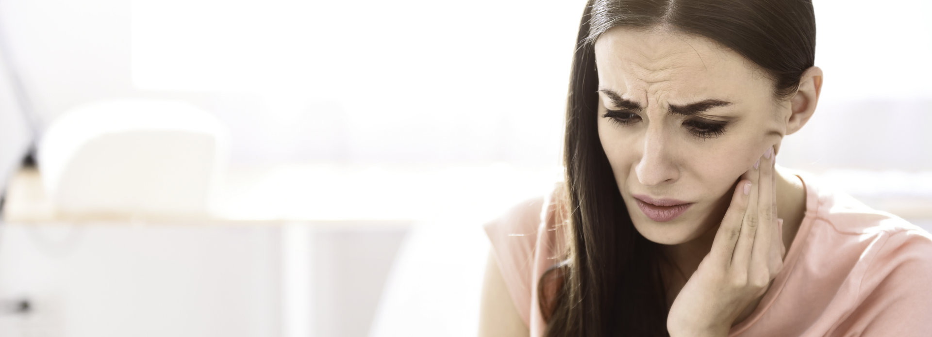 woman suffering from dental pain