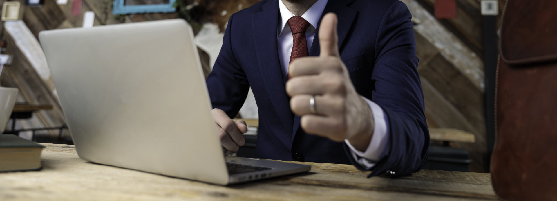 a businessman showing his thumb up