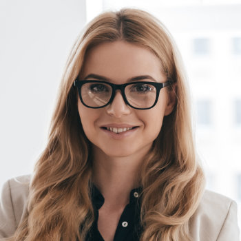 businesswoman in glasses smiling calmly