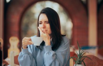 Woman Drinking Coffee Feeling Tooth Pain From Teeth Sensitivity