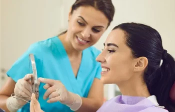 Dentist examining patient for restorative dental implants procedure