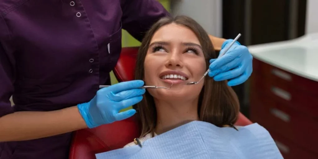 Patient smiling during same day dental extraction visit