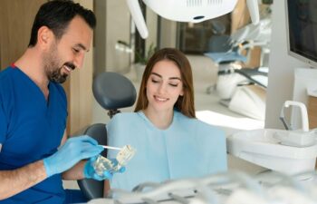 Dentist explaining dental implant treatment to patient
